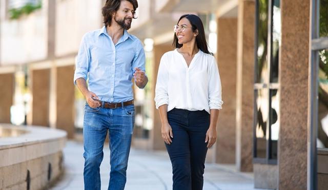 Friends walking by building