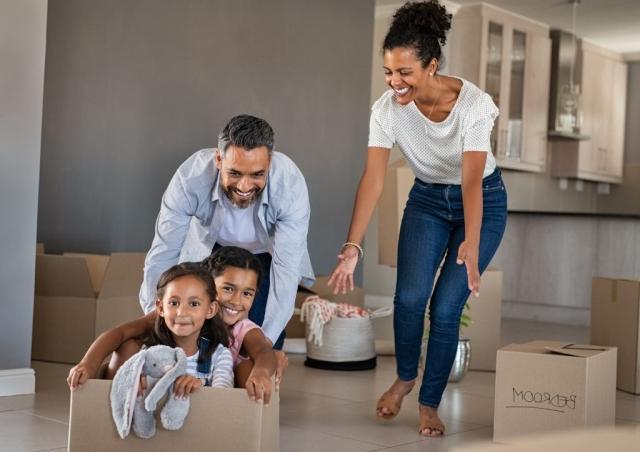 Family having fun in new house